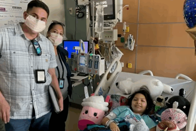 TorresStory Savannah Torres receiving treatment in a hospital room with the Department of Corrections team members by her side
